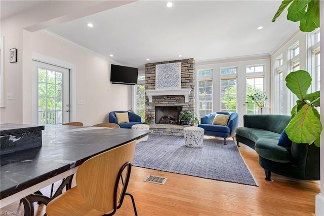 3054 Country Club Rd, Winston-Salem, NC 27104 - living room with ornamental molding, healthy amount of natural light, light wood-style floors, a fireplace, and recessed lighting