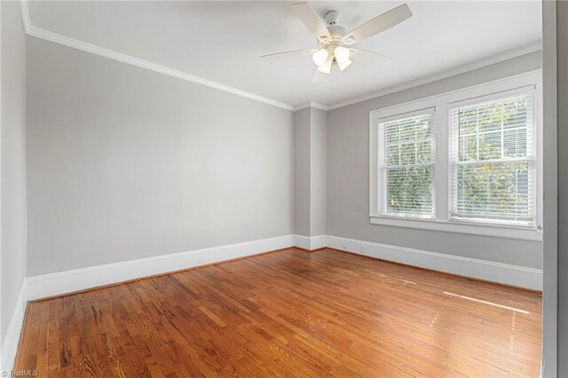 3054 Country Club Rd, Winston-Salem, NC 27104 - spare room with baseboards, wood finished floors, crown molding, and a ceiling fan