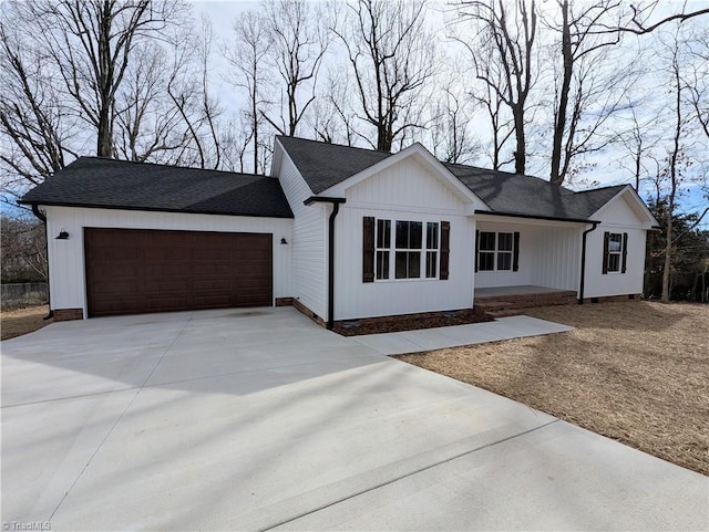 view of front of home featuring a garage and driveway