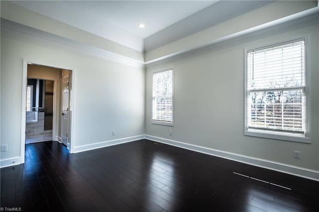 empty room with dark wood-style floors and baseboards