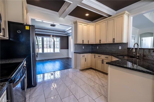 kitchen featuring crown molding, cream cabinetry, black range with electric stovetop, and a sink