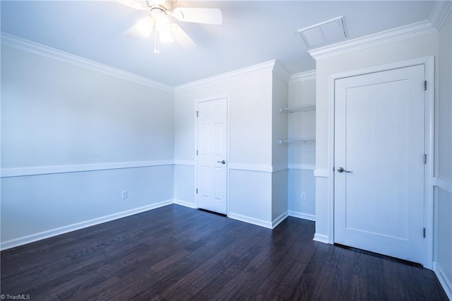 unfurnished bedroom featuring dark wood finished floors, a closet, visible vents, ornamental molding, and baseboards