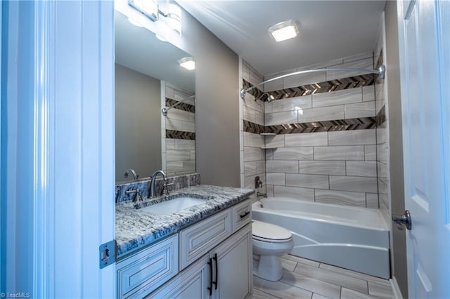 full bath featuring tub / shower combination, vanity, and toilet