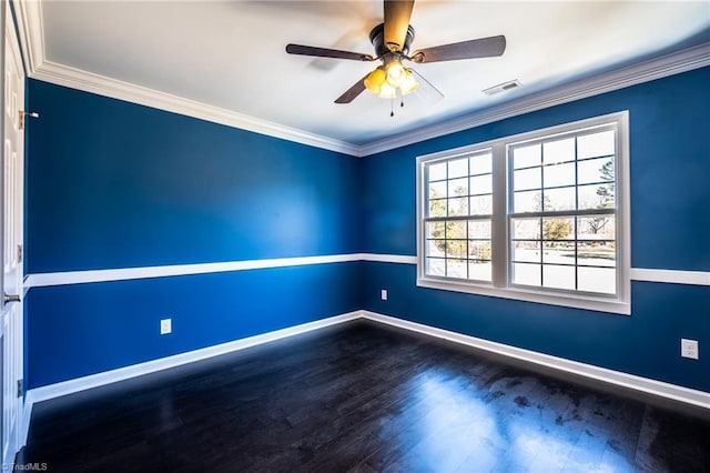 unfurnished room with baseboards, dark wood finished floors, and crown molding