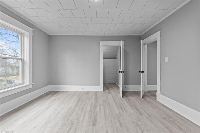 unfurnished bedroom featuring light wood-type flooring