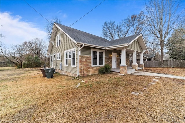 view of front of property with a porch and a front lawn