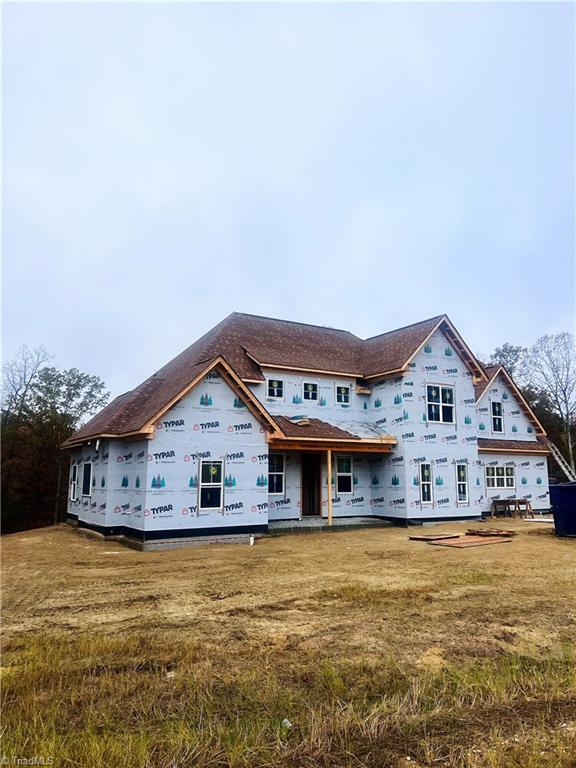 property under construction with a front yard