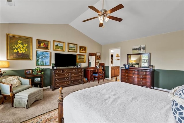 carpeted bedroom featuring ceiling fan, visible vents, baseboards, lofted ceiling, and ensuite bathroom