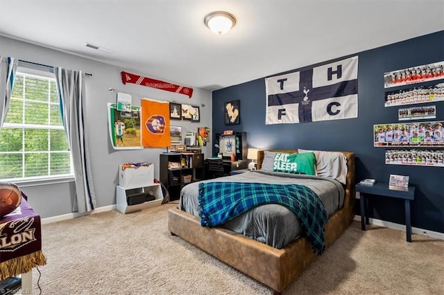 bedroom with visible vents, baseboards, and carpet floors