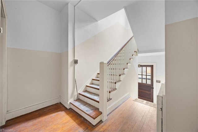 stairs with wood-type flooring