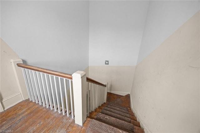 staircase with wood finished floors