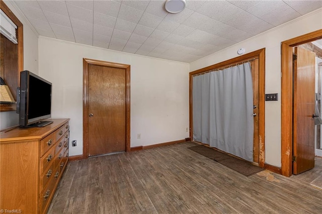 356 Davie Academy Rd, Mocksville, NC 27028 - unfurnished bedroom featuring wood finished floors, ornamental molding, and baseboards