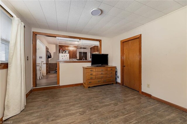 356 Davie Academy Rd, Mocksville, NC 27028 - unfurnished living room with wood finished floors, baseboards, and crown molding