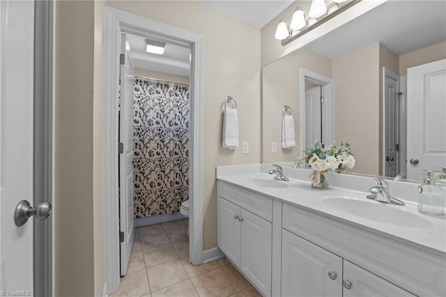 bathroom featuring a shower with curtain, tile patterned floors, toilet, and vanity