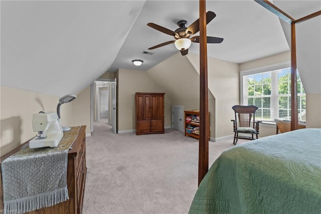 bedroom featuring vaulted ceiling, ceiling fan, and light colored carpet