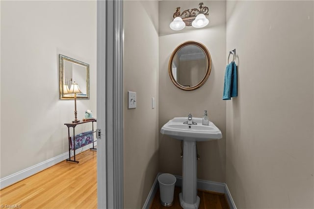 bathroom with hardwood / wood-style floors and sink