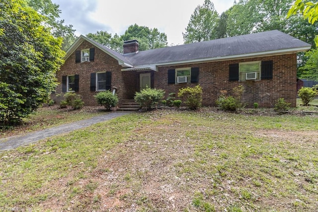 4984 US Highway 220, Asheboro, NC 27205 - view of front of property featuring a chimney, brick siding, a front lawn, and cooling unit
