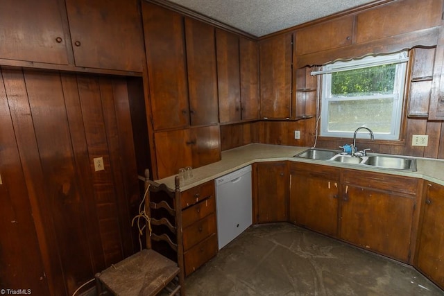 4984 US Highway 220, Asheboro, NC 27205 - kitchen featuring a sink, white dishwasher, light countertops, a textured ceiling, and brown cabinetry
