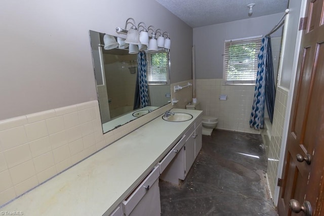 4984 US Highway 220, Asheboro, NC 27205 - full bath featuring tile walls, healthy amount of natural light, toilet, vanity, and a textured ceiling
