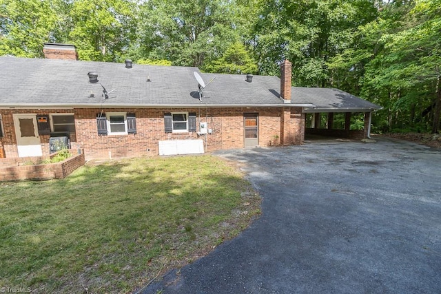 4984 US Highway 220, Asheboro, NC 27205 - view of front of house featuring a chimney, driveway, brick siding, and a front yard