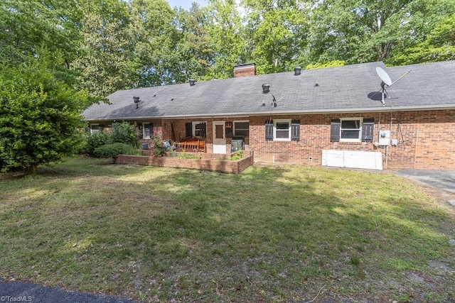 4984 US Highway 220, Asheboro, NC 27205 - back of house featuring a lawn, brick siding, and a chimney