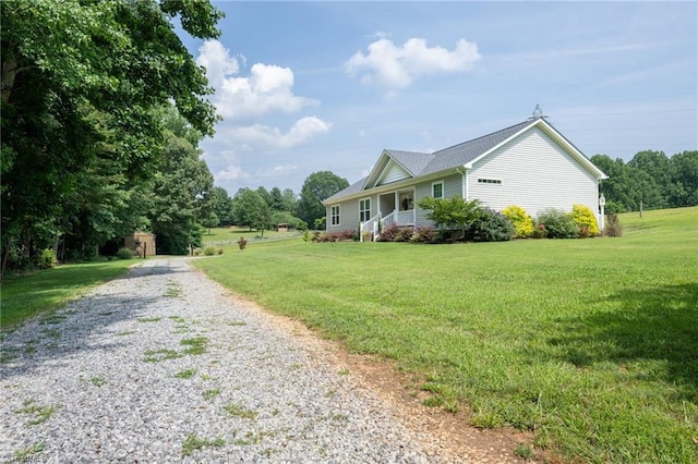 742 Teague Rd, Winston-Salem, NC 27107 - view of side of property with driveway, a yard, and covered porch