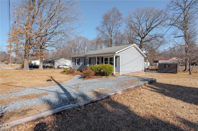 ranch-style house with a storage shed