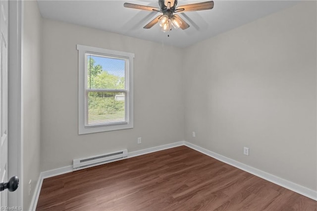 empty room with baseboard heating, dark wood-style flooring, ceiling fan, and baseboards