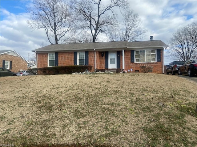 ranch-style house with a front lawn