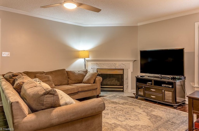 97 Shadylawn Dr, Winston-Salem, NC 27104 - living area featuring crown molding, a ceiling fan, a fireplace, a textured ceiling, and wood finished floors
