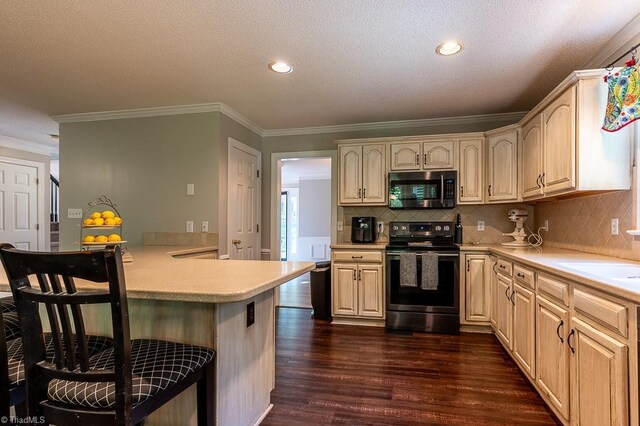 97 Shadylawn Dr, Winston-Salem, NC 27104 - kitchen with electric range, stainless steel microwave, a breakfast bar, light countertops, and dark wood-type flooring