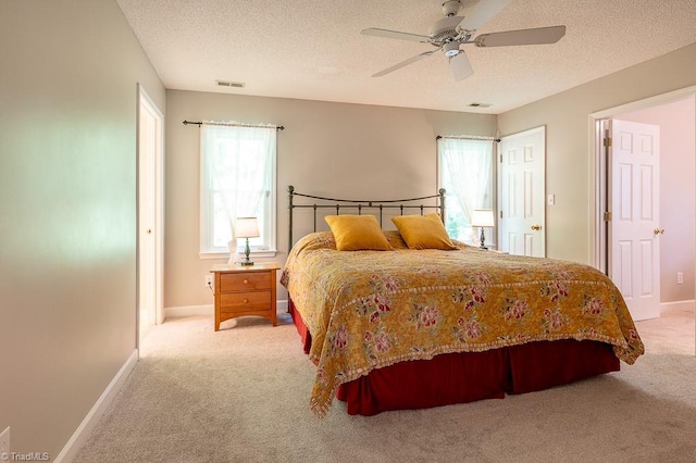 97 Shadylawn Dr, Winston-Salem, NC 27104 - bedroom featuring carpet floors, a textured ceiling, and a ceiling fan