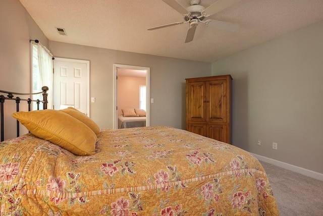 97 Shadylawn Dr, Winston-Salem, NC 27104 - bedroom featuring carpet floors, a textured ceiling, and a ceiling fan