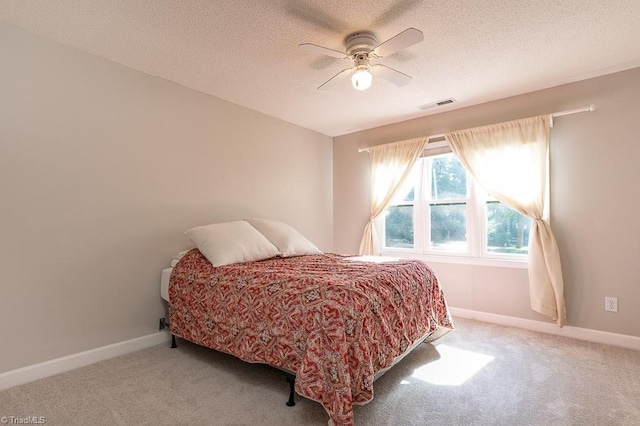 97 Shadylawn Dr, Winston-Salem, NC 27104 - carpeted bedroom featuring a textured ceiling and a ceiling fan