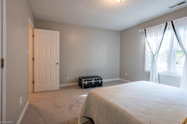 97 Shadylawn Dr, Winston-Salem, NC 27104 - carpeted bedroom featuring baseboards and a textured ceiling