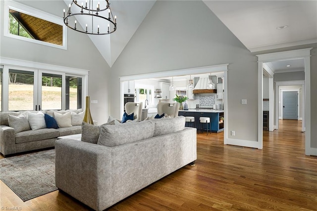 living room featuring a wealth of natural light, high vaulted ceiling, and dark hardwood / wood-style floors