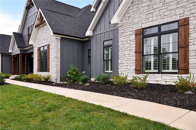 view of home's exterior with a yard