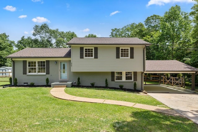 317 Benbow Dr, East Bend, NC 27018 - split level home featuring an attached carport, a front yard, roof with shingles, and driveway