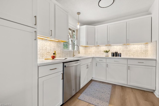317 Benbow Dr, East Bend, NC 27018 - kitchen featuring dishwasher, a sink, light countertops, white cabinetry, and light wood finished floors