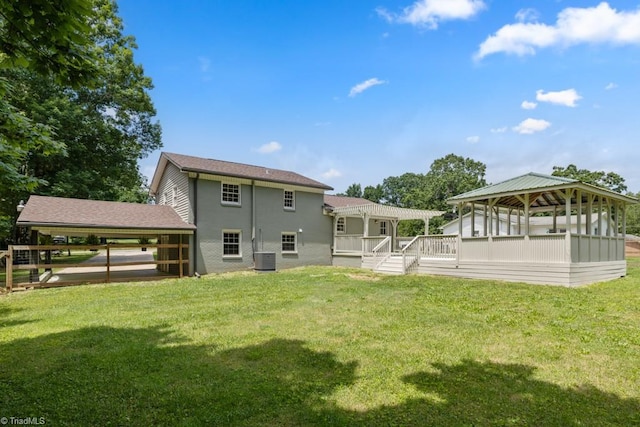 317 Benbow Dr, East Bend, NC 27018 - back of property with a gazebo, a deck, a yard, central AC, and stucco siding