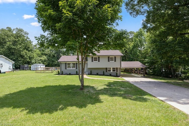 317 Benbow Dr, East Bend, NC 27018 - split level home with driveway, a front yard, and view of wooded area