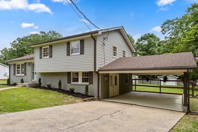 317 Benbow Dr, East Bend, NC 27018 - view of front facade with driveway, brick siding, a carport, and a shingled roof