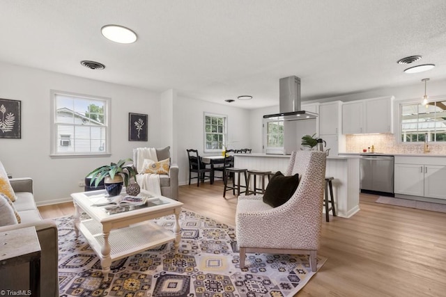 317 Benbow Dr, East Bend, NC 27018 - living area featuring light wood-style floors and baseboards