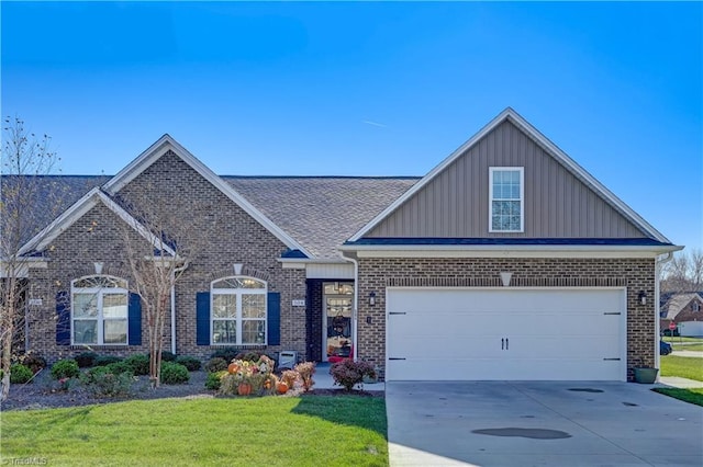 view of front of house featuring a front yard and a garage