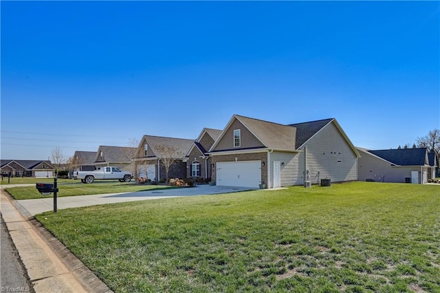 view of front of property featuring a garage and a front lawn