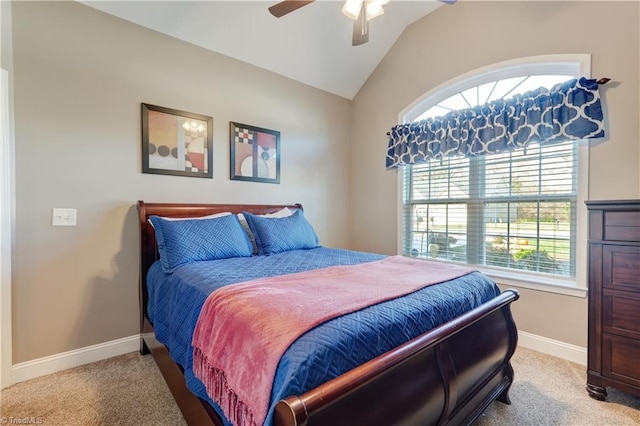 bedroom with light colored carpet, vaulted ceiling, and ceiling fan