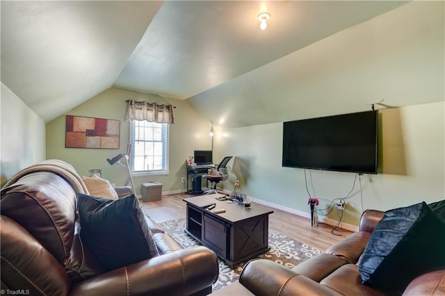 living room with light hardwood / wood-style flooring and vaulted ceiling