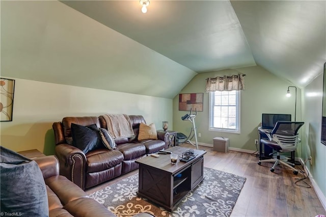 living room featuring hardwood / wood-style floors and lofted ceiling