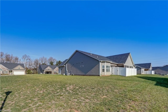 view of side of property featuring a yard