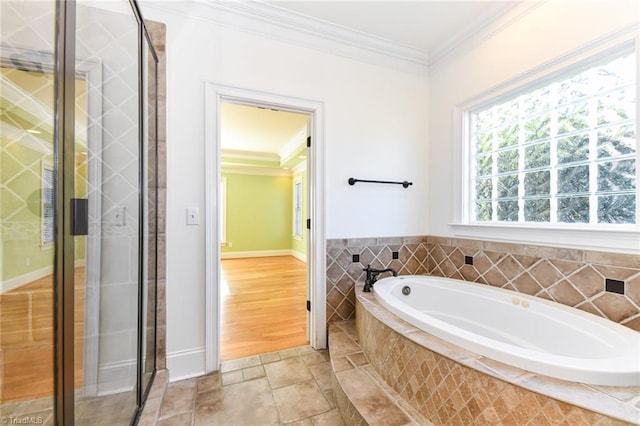 bathroom featuring shower with separate bathtub and ornamental molding